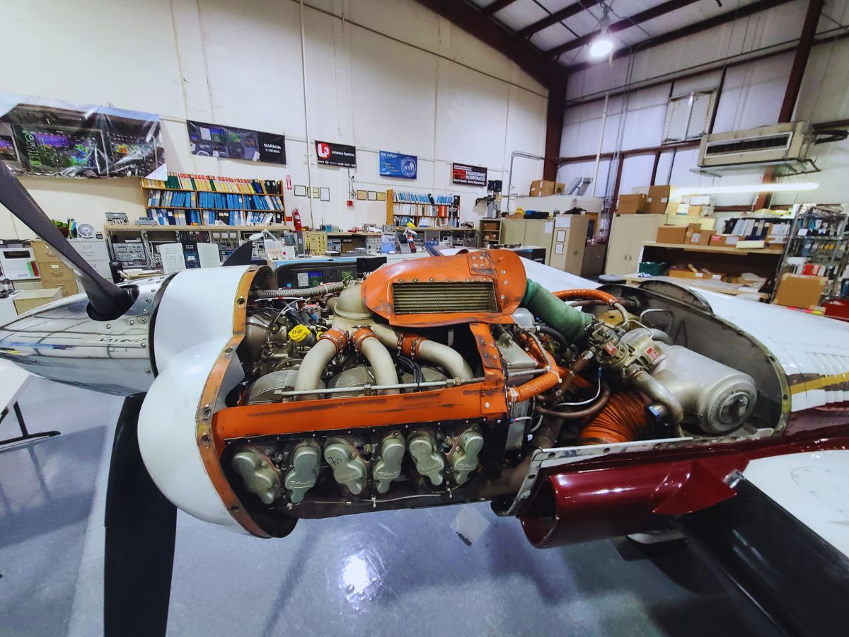 Palm Beach Avionics workshop showing a plane in service.