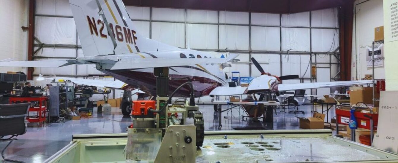 Palm Beach Avionics workshop showing a plane in service.