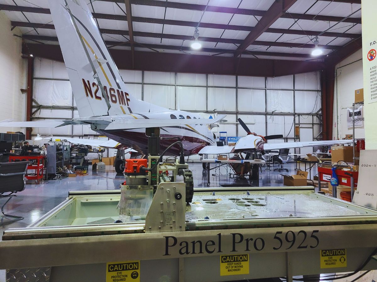 Palm Beach Avionics workshop showing a plane in service.