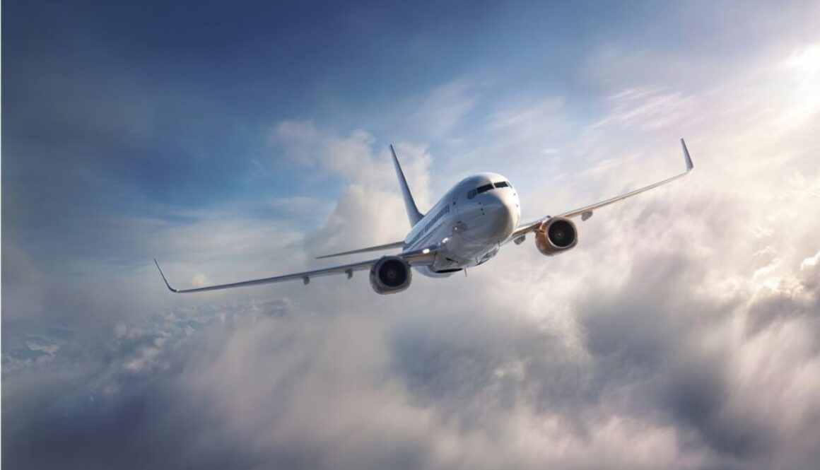 Commercial jet airplane ascending through thick clouds under a blue sky, illustrating the type of lateral-directional instability known as dutch roll that can affect aircraft in flight.