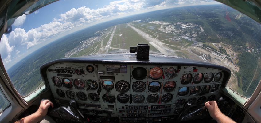 Panoramic view from airplane cockpit during flight with full instrument panel, illustrating gyroscopic precession aviation