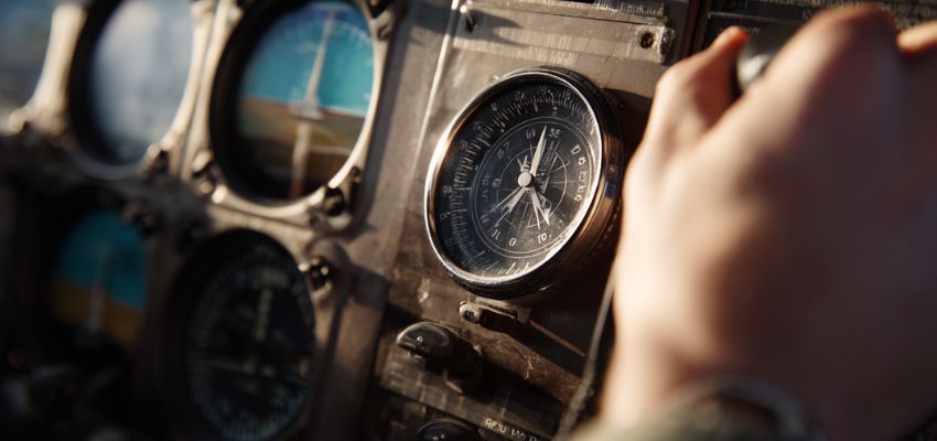 Aircraft magnetic compass showing potential errors during flight - close-up view in cockpit